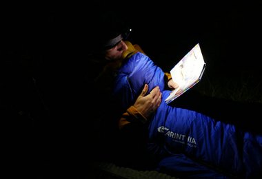 Gerhard Schaar - reading NZL traveller guide at night - Lake Alexandria